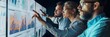 © Elmira - A business team collaborates in a dimly lit room, analyzing data displayed on a large screen. They point at the screen, engaging in lively discussion and strategizing their next moves