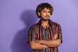 © deagreez - Photo of serious confident man with beard wavy hairdo dressed print shirt hold arms folded look at you isolated on purple color background