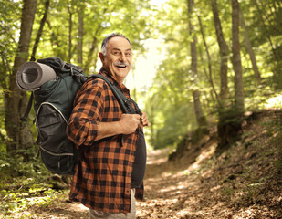 Sticker - Cheerful mature hiker with a backpack smiling