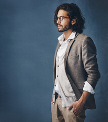 Poster - Business, man and fashion with portrait in studio for glasses of stylish, suit and formal aesthetic of corporate career. Confident, male person and hands in pocket as executive on grey background