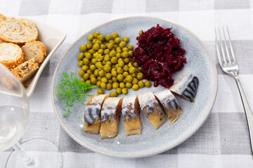 Canvas Print - Cold smoked mackerel with grated beetroot and green peas served in a plate with other table appointments