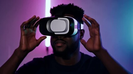 Poster - A man with a beard wears a virtual reality headset in front of pink and blue neon lights.