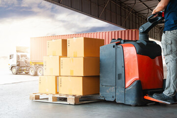 Wall Mural - Warehouse Workers Loading a Package Boxes on Pallets at Warehouse. Electric Forklift Pallet Jack Loader. Distribution Storage Warehouse. Supply Chain, Supplies Warehouse Shipping. Logistics.