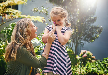 Sticker - Happy, girl and mom with flower in garden for playful humour, love and childhood development. Woman, smile and daughter with plants in backyard for motherhood care, summer fun and bonding together