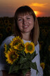© Олег Мальшаков - Beautiful young girl in a white dress in sunflowers