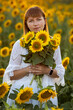 © Олег Мальшаков - Beautiful young girl in a white dress in sunflowers