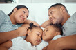© David/peopleimages.com - Parents, children and sleeping on bed in home for relax, fatigue and break together on weekend. Family, kids and mother with father, girls and smile in bedroom for rest, tired and quiet in morning