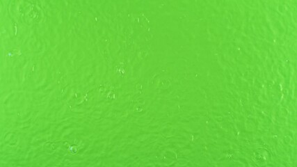 Fototapete - Super Slow Motion of Water Drops Falling Down in Extreme Detail. Isolated on Green Screen Background. Filmed on High Speed Cinema Camera, 1000fps.