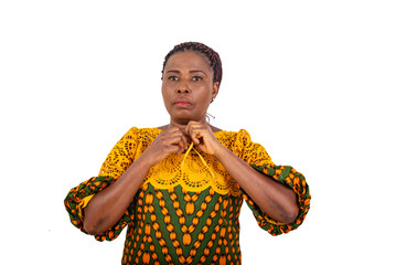 Poster - close up of a beautiful mature woman tying her dress knot.