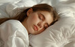 © JoelMasson - A girl sleeping on a comfy white pillow