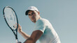 © Bonsales - Tennis player preparing to hit a shot, dressed in white shirt and cap under clear sky. Focused expression and athletic build emphasize concentration and physical fitness