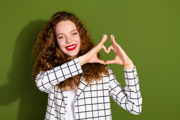 Poster - Photo portrait of lovely young lady show heart symbol hands dressed stylish white plaid garment isolated on khaki color background