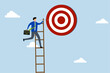 © dwara - Success ladder, businessman climbs a ladder high into the sky, trying to reach perfect pinball table.
