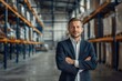 © Anna - Portrait of man factory owner or manager in business suit on background warehouse. Banner industrial plant process