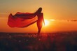 © Anna - Silhouette of superhero woman with her red cape blowing in the wind at sunset