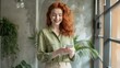 © MP Studio - The redhead woman with smartphone