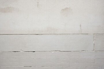 Wall Mural - close-up of white brick wall with textured surface and subtle imperfections
