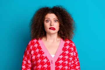 Wall Mural - Photo of scared attractive lady dressed red cardigan biting lip empty space isolated blue color background