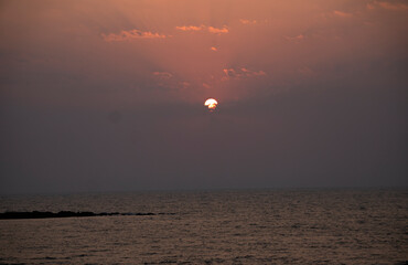 The setting sun at Murud beach. Murud is located 60 kms south of Alibag on the west coast of India.