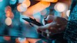 © svastix - A close-up shot of a hand holding a smartphone in an urban setting with colorful bokeh lights in the background, depicting modern communication and connectivity.