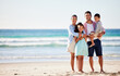 © peopleimages.com - Happy family, ocean and smile in portrait for holiday or travel, solidarity in Mexico with children. Mom, dad and kids by beach for vacation with sea adventure, freedom in nature with mockup space