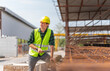 © Poguz.P - Engineer man with digital tablet inspects the construction site, Site manager works on construction site