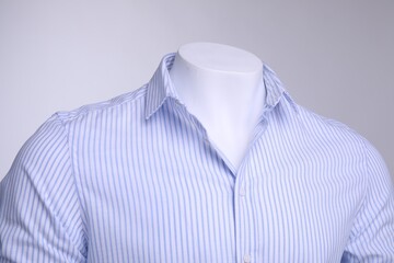 Wall Mural - Male mannequin dressed in stylish shirt on grey background, closeup