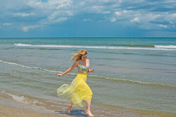 Wall Mural - Natural woman's beauty concept. Lady at the beach in romantic feminine style