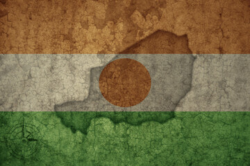 Wall Mural - map and flag of niger on a old vintage crack paper background .