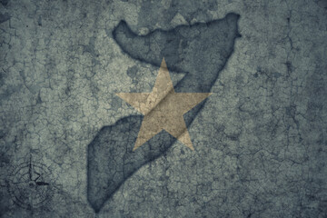 Wall Mural - map and flag of somalia on a old vintage crack paper background .