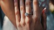 © PSCL RDL - Close up on a wedding ring with a diamond on a woman's hand. Marrying and vows concept motif