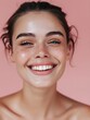 © Pascal - Close-up portrait of a smiling young woman on a pink background, embodying beauty and youthfulness