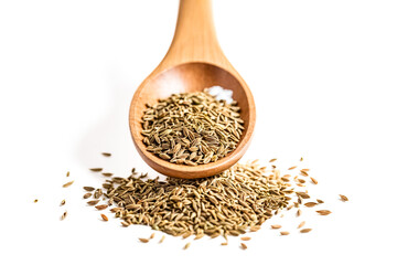 Poster - Wooden spoon filled with cumin seeds spilling onto a white background