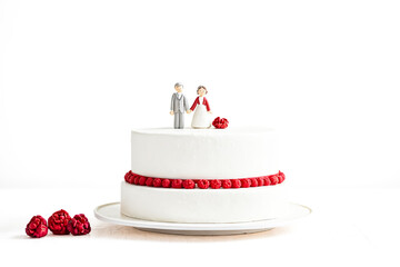 Canvas Print - White Wedding Cake with Red Raspberries and Couple Topper