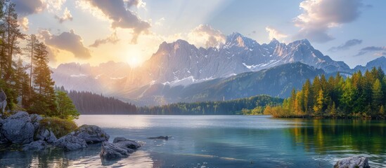 Wall Mural - Sunrise Over a Serene Mountain Lake