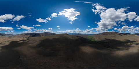 Wall Mural - Aerial 360  VR Panoramic Desert Landscape View with Mountains. Sunny Cloudy Day.