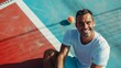 © liliyabatyrova - A man is sitting on a tennis court with a tennis ball and a tennis racket
