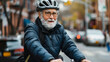 © Maestro - Senior man cycling in city street, wearing helmet and glasses, enjoying outdoor exercise