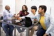 © ADDICTIVE STOCK - Diverse team of educators celebrating teamwork in English academy