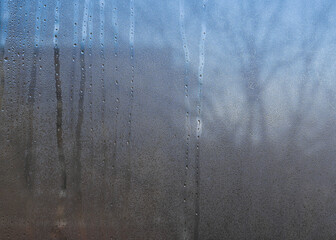 Wall Mural - the fogged glass of the plastic window.