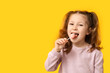 © Pixel-Shot - Cute little girl with lollipop on color background