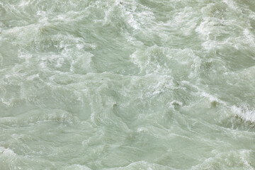 pattern of fresh flowing river water with foam