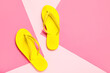 © Pixel-Shot - Yellow flip flops on color background