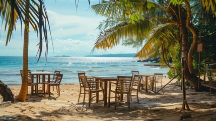 Wall Mural - chairs and tables on a paradise beach with palm trees on a sunny day