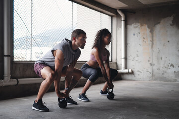 Wall Mural - Strong, kettlebell and man with woman in gym for muscle development, power challenge or weightlifting. Exercise, wellness and workout friends for body training, fitness routine or bodybuilding