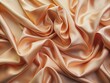 © Man888 - Softly folded peach silk fabric forms an elegant background, creating a dreamy and luxurious atmosphere perfect for design presentations and creative visual projects.
