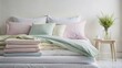 © janya - Freshly laundered bed linens in soft pastel colors on background, bedding, sheets, pillowcases, blankets, laundry, clean, stack