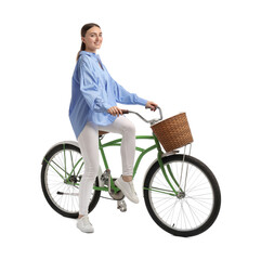 Wall Mural - Smiling woman on bicycle with basket against white background