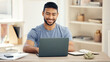 © peopleimages.com - Smile, typing and man with laptop, online and virtual assistant in home office and notebook. Digital, employee and remote work for schedule of company, computer and reading of person in house