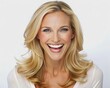 © DigitalArt Max - Radiant blonde woman in her mid-thirties with a bright smile and infectious laugh, showcasing a flawless, clean, and fresh face against a pure white background.
